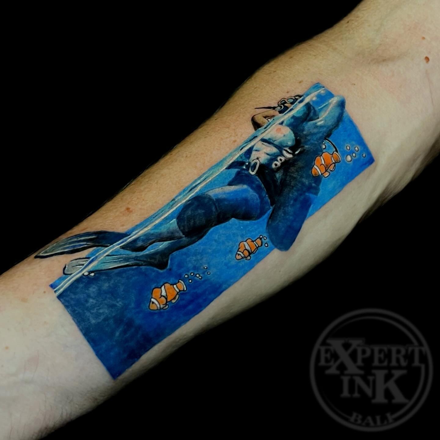 Diving tattoo on the Forearm by Expert Ink Bali, showcasing intricate shading and fine detailing.