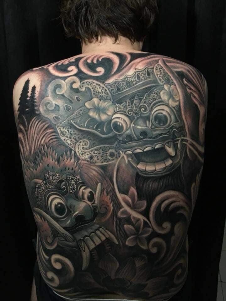Full back Balinese tattoo featuring traditional mythological creature design