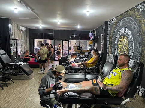 Artists working inside a Bali tattoo studio, showcasing the creativity and skills behind Bali tattoo trends