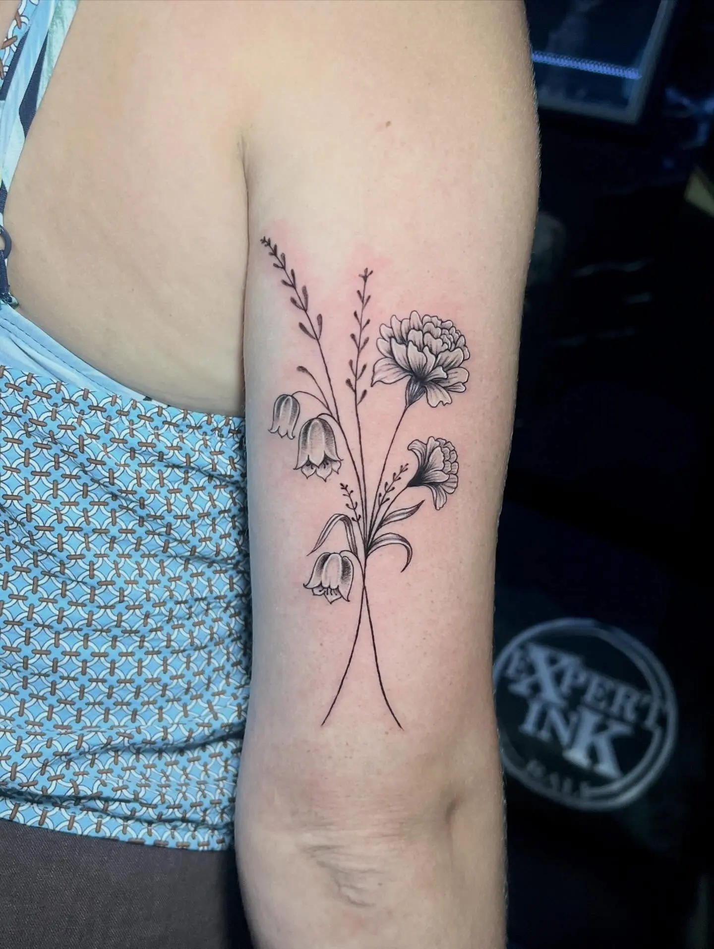 Fine line tattoo kuta with delicate single-needle detailing on the forearm
