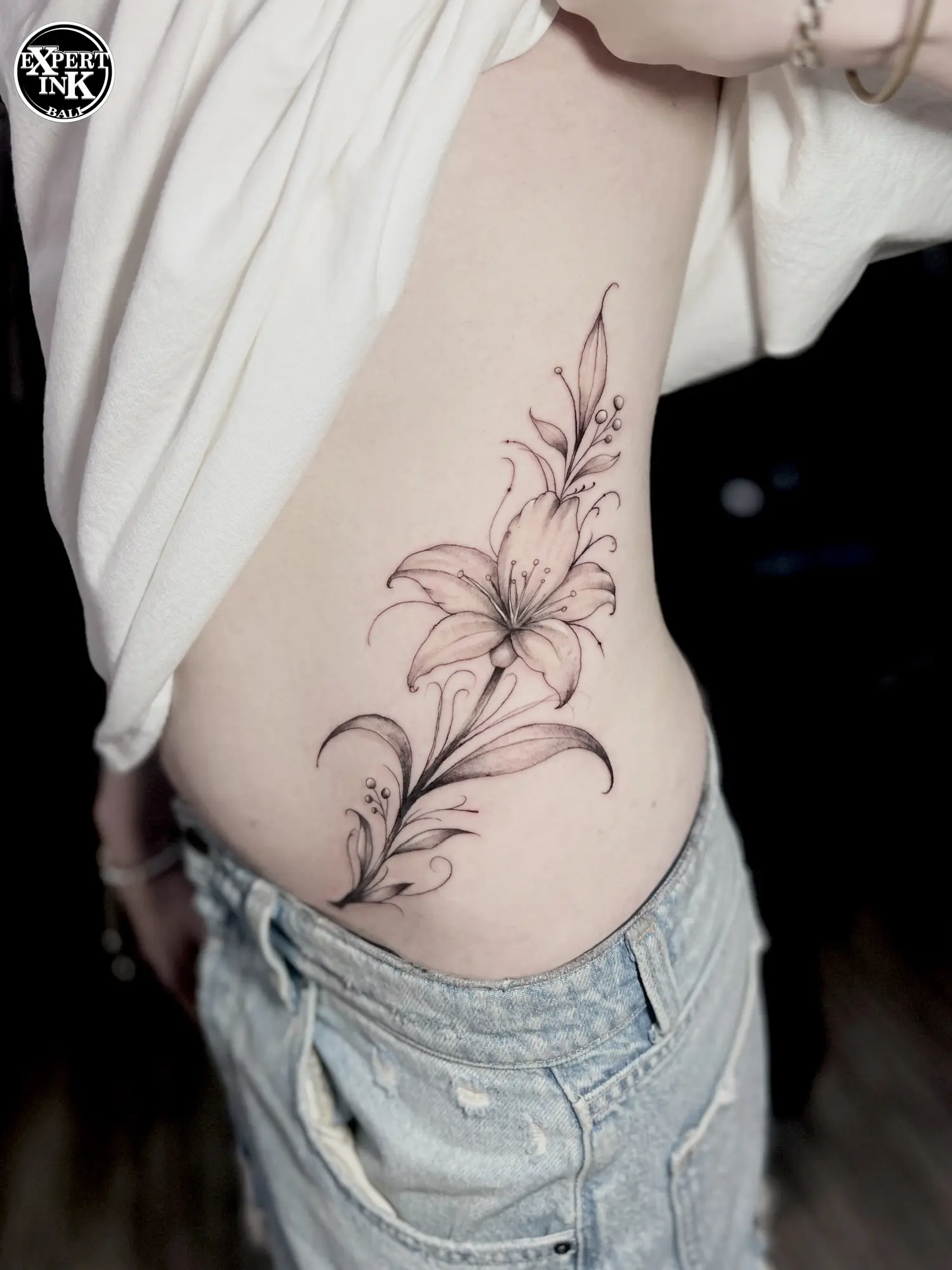 One of the popular tattoo styles Bali offers: a delicate fine line piece of floral design