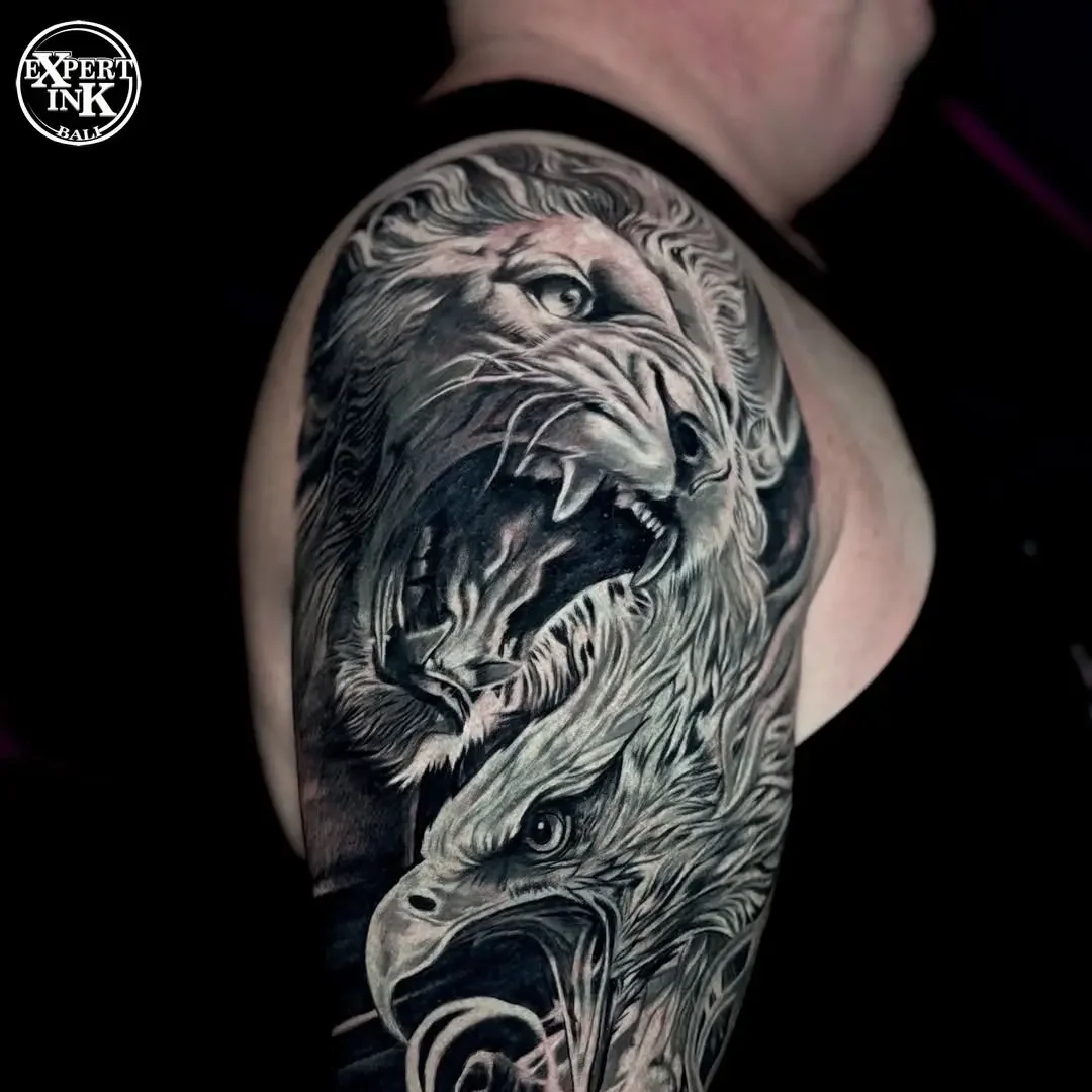 Realistic tattoo design in Bali Kuta featuring a clash between lion and eagle