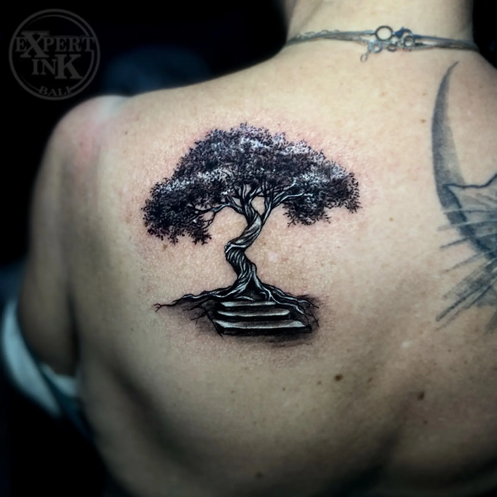Bold small back tattoo Kuta designs blending realism and spiritual sense